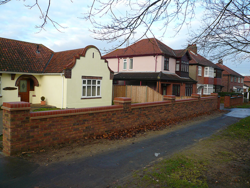 Gary Cooper Paving 9 inch brick wall with 18inch piers, double